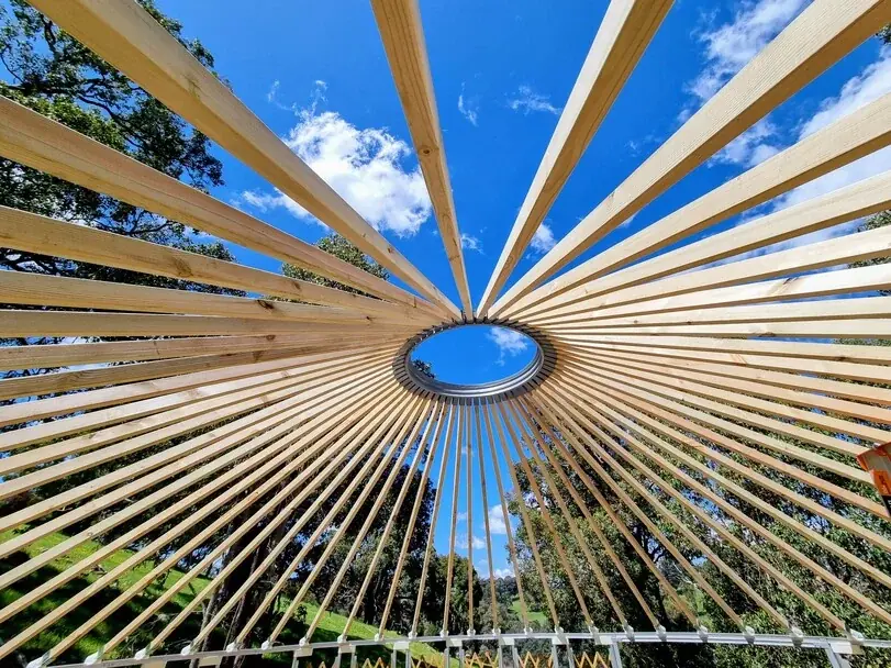 Pine roof rafters and top ring of a 6.3m Yurt