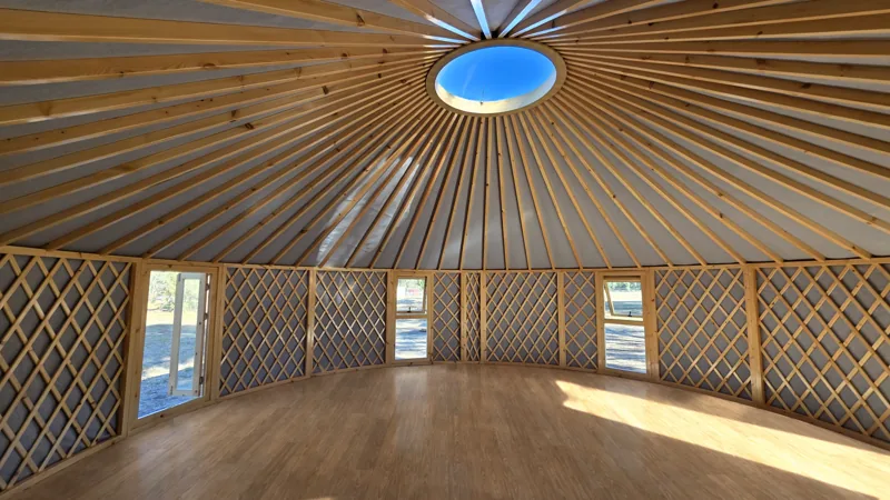 Inside Tanya's 8m ORON yoga studio, empty with a warm oak plank floor