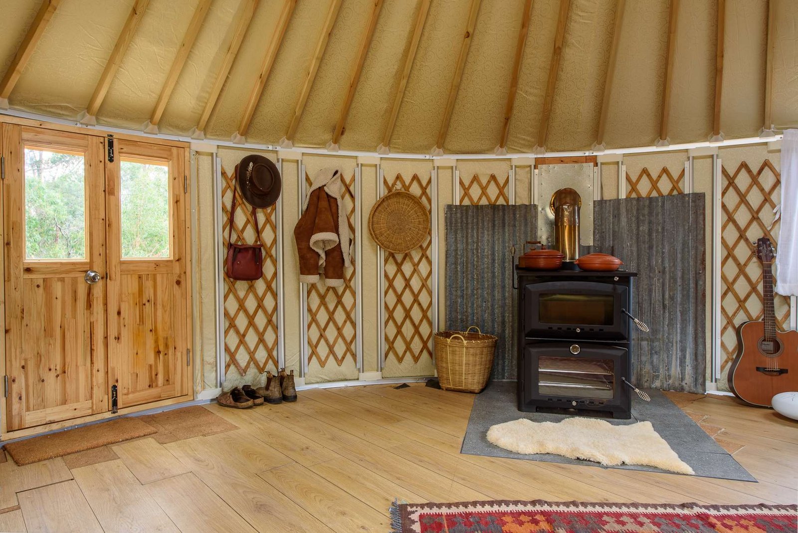 Wood heater warming an insulated yurt interior during an Australian winter, heating a yurt off grid
